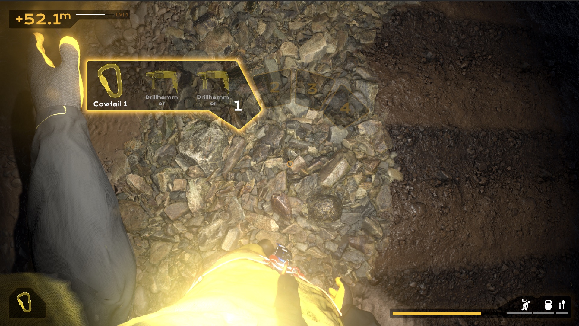 A caver selecting a carabiner and drillhammer while examining loose rock in Cave Expedition
